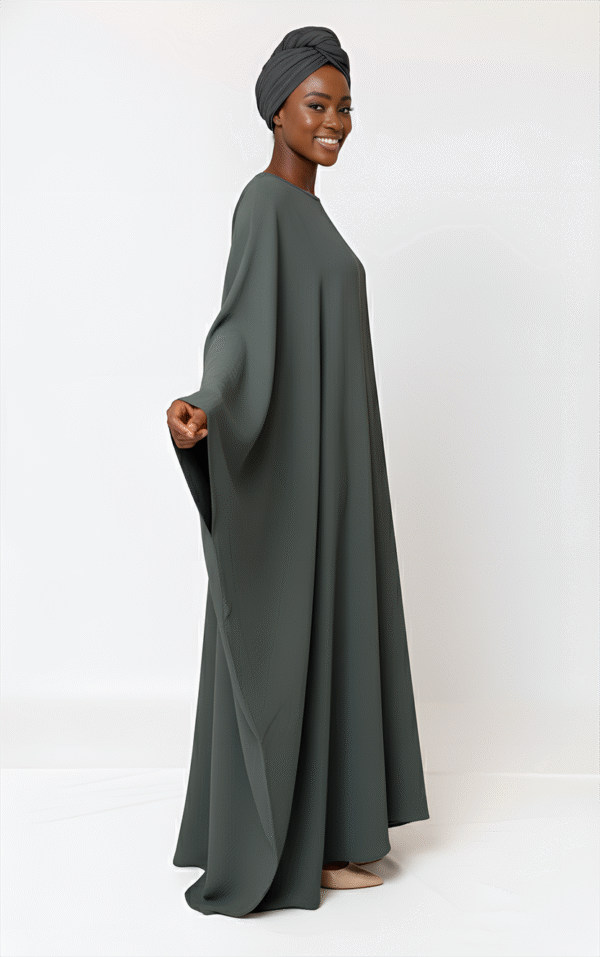 Stylish modest women's dress with headscarf, offering elegant and comfortable fashion for cultural events or formal gatherings.