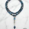 Blue gemstone beaded necklace with silver accents and a tassel, handmade jewelry from Umeed Designs.