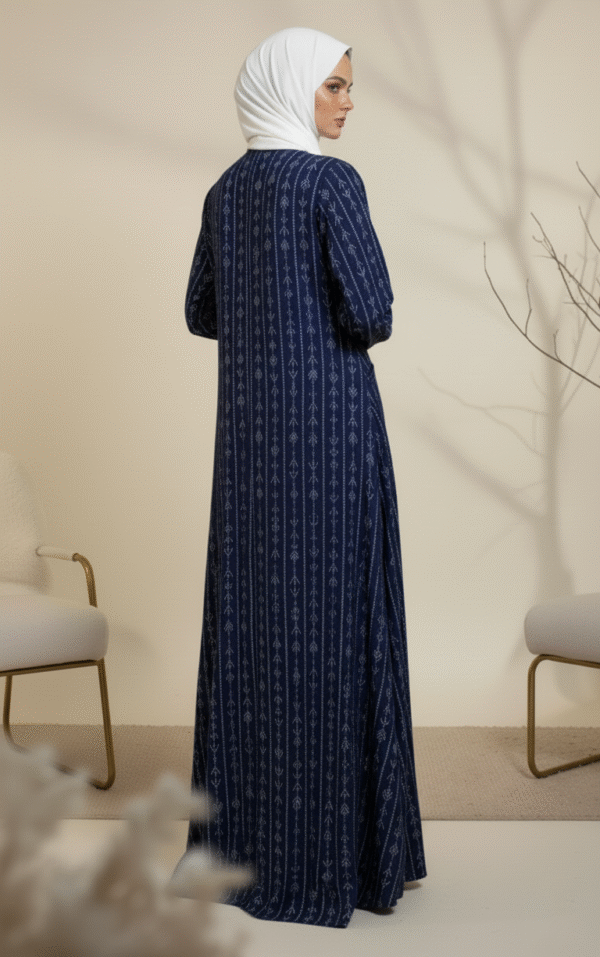 Elegant modest blue dress with white embroidery, perfect for special occasions.