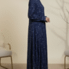 Women’s navy blue embroidered dress with intricate white patterns, modest and stylish for special occasions.