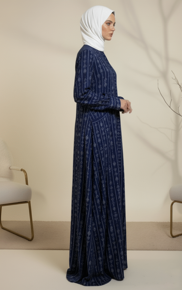 Women’s navy blue embroidered dress with intricate white patterns, modest and stylish for special occasions.