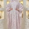 Elegant floral abaya with matching hijab for women, featuring a modest design and intricate pink and.