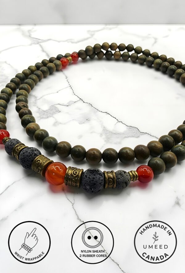 Elegant handmade beaded necklace with black, red, and gold beads from Umeed Designs.