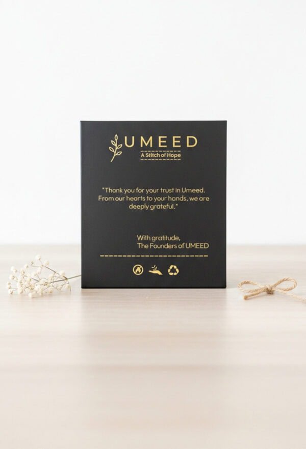 Umeed Designs thank you card with gold accents and minimalist style.