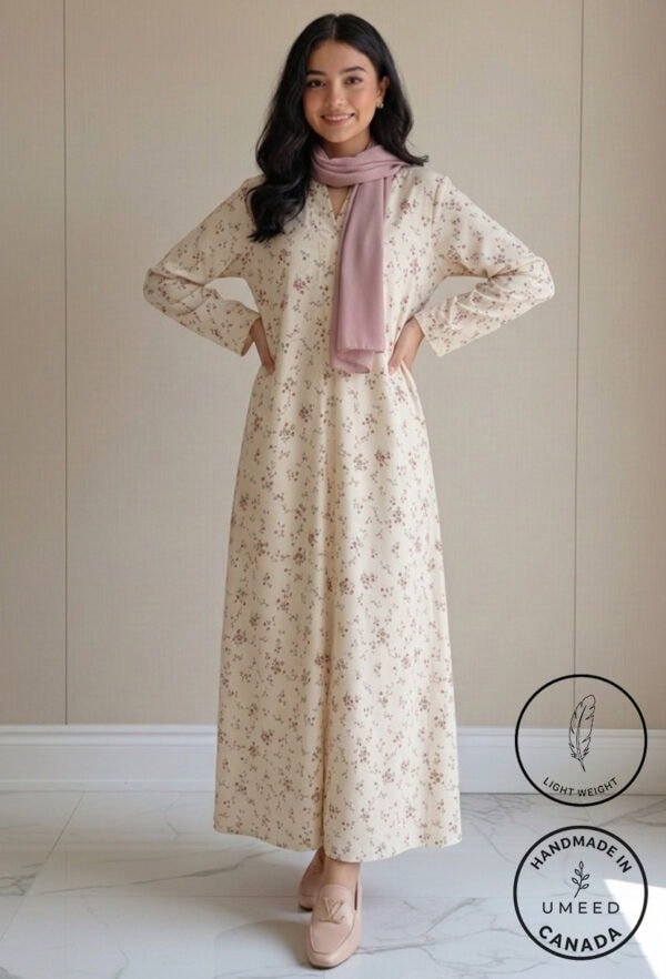 Elegant floral maxi dress with long sleeves and a pink scarf, perfect for casual or special occasion.