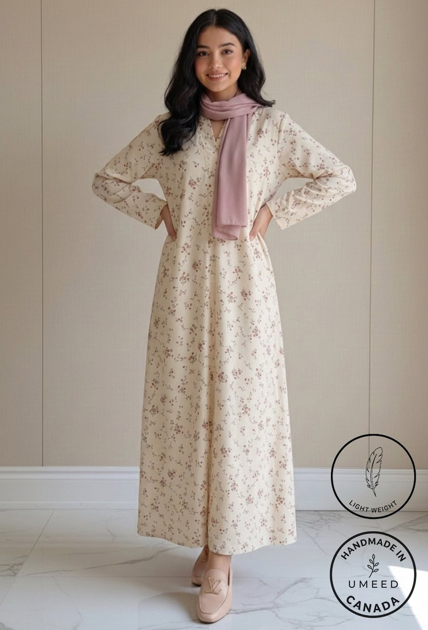 Elegant floral maxi dress with long sleeves and a pink scarf, perfect for casual or special occasion.