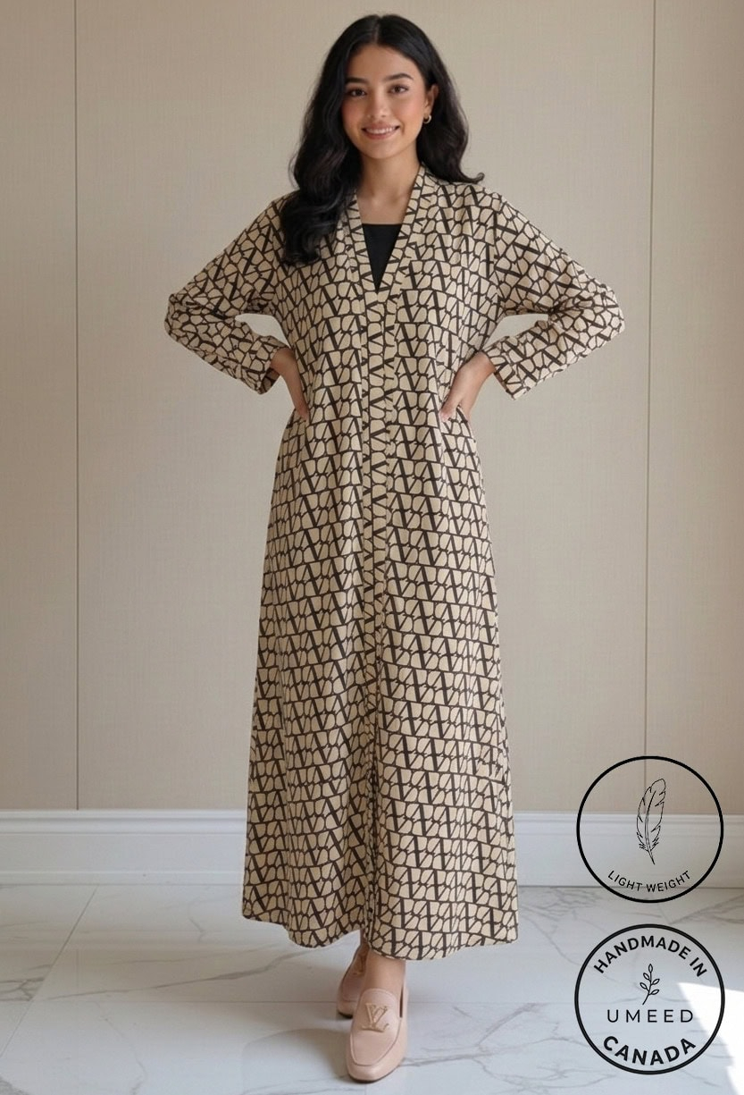 Woman wearing a stylish geometric patterned dress by Umeed Designs.