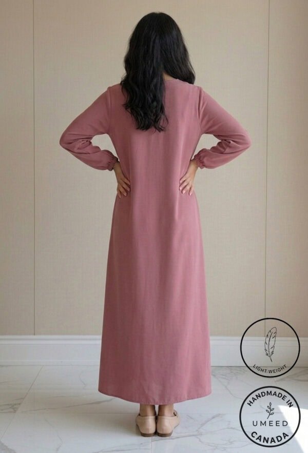 Elegant pink maxi dress with long sleeves, perfect for casual or formal occasions. Handmade and craf.