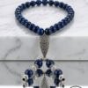 Handmade blue beaded necklace with intricate silver pendant, crafted by Umeed Designs in Canada.