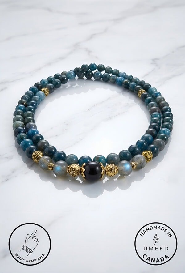 Blue and black beaded bracelet with gold accents, handmade jewelry from Umeed Designs.