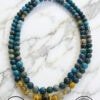 Handmade blue gemstone beaded necklace with gold accents from Umeed Designs.