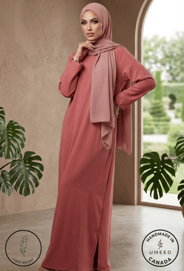 Modest pink dress with matching hijab, perfect for special occasions and everyday wear.