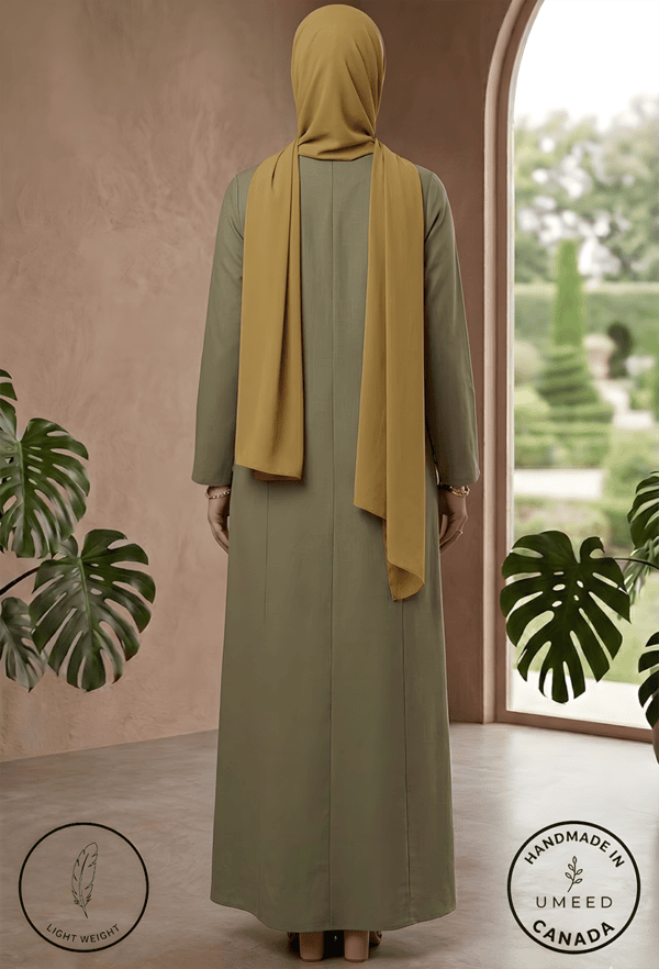 Modest olive-green dress with mustard hijab, perfect for elegant and cultural occasions. Handmade in.