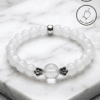Elegant white beaded bracelet with floral accents, handmade in Canada.