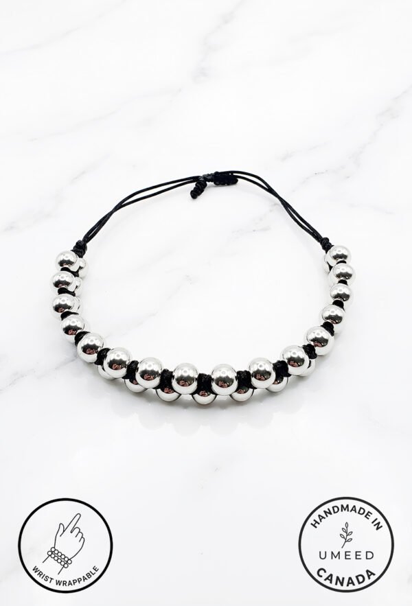 Handmade black and silver beaded bracelet with adjustable cord from Umeed Designs.