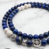 Elegant blue and white beaded bracelet with silver charms from Umeed Designs.