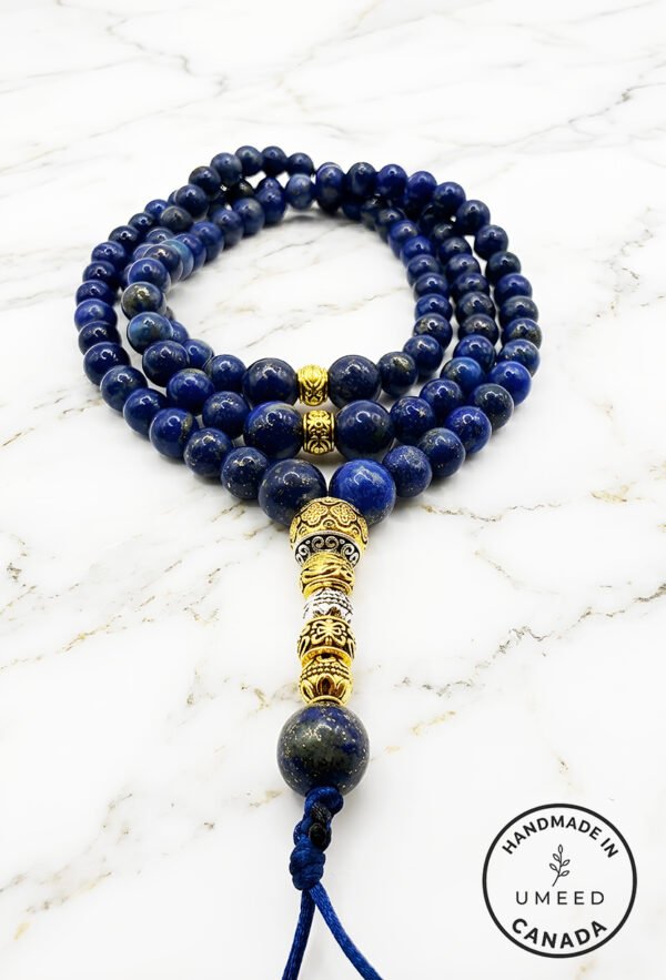 Elegant blue gemstone beaded necklace with gold accents from Umeed Designs.