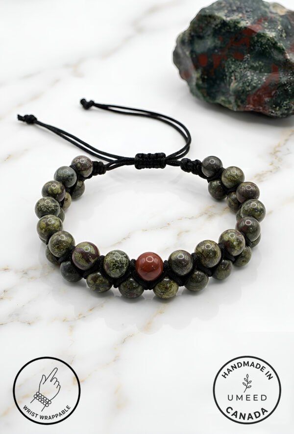 Handmade green and brown beaded bracelet with adjustable cord from Umeed Designs.