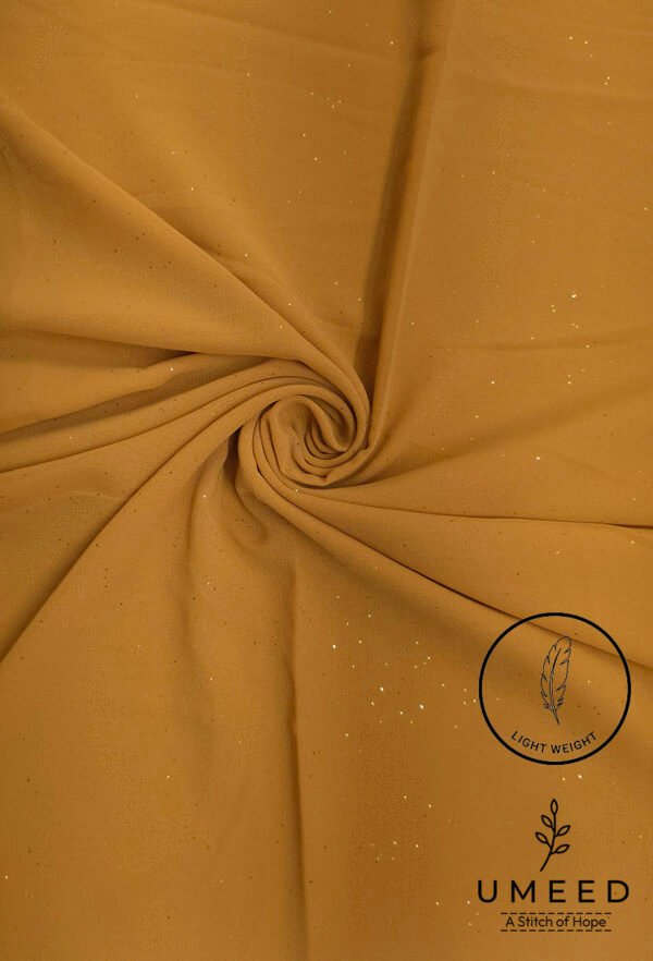 Light weight mustard yellow fabric with subtle glitter and feather logo.
