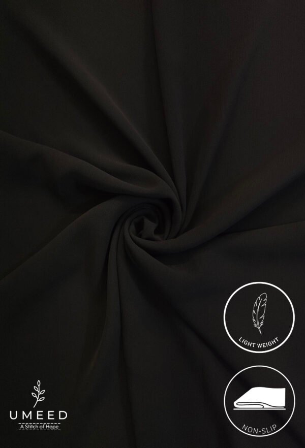 Black lightweight, non-slip fabric with a smooth texture for clothing or accessories.