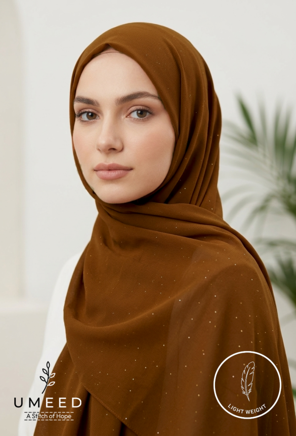 Elegant woman wearing a brown hijab with subtle sparkles for modest fashion.