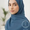 Elegant woman wearing a blue hijab with light weight and non-slip features.