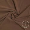 Lightweight brown fabric with subtle glitter accents for elegant fashion design.