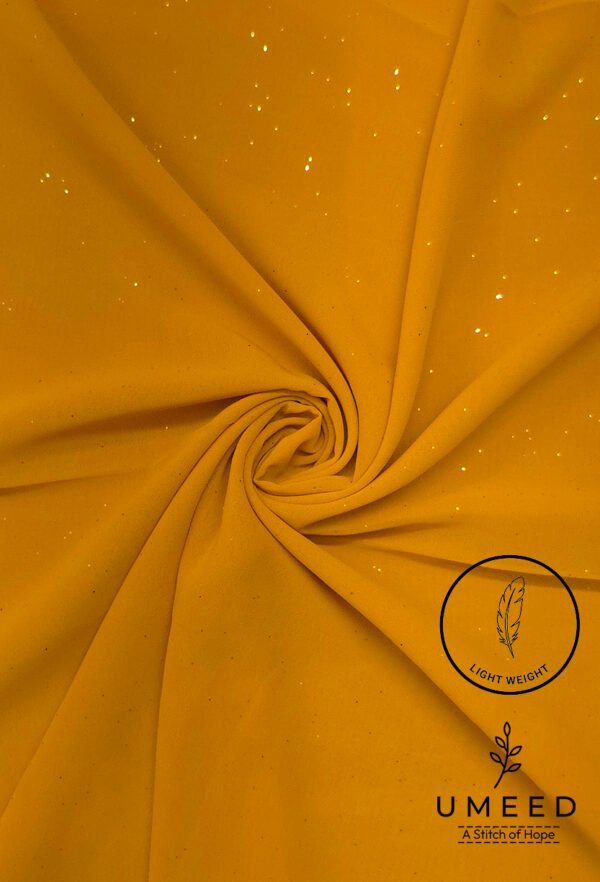 Yellow fabric with glitter and light weight label from Umeed Designs.