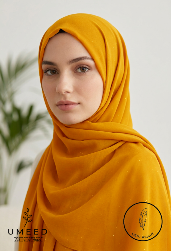 Beautiful woman wearing a mustard yellow hijab with subtle polka dots.