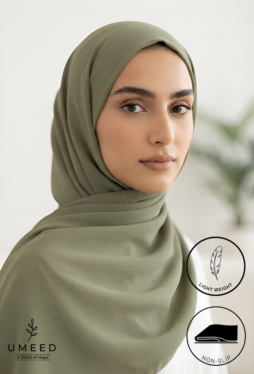 Elegant woman wearing a light weight, non-slip olive green hijab from Umeed Designs.
