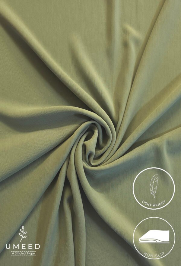 Lightweight, non-slip fabric in soft green for comfortable clothing or accessories.