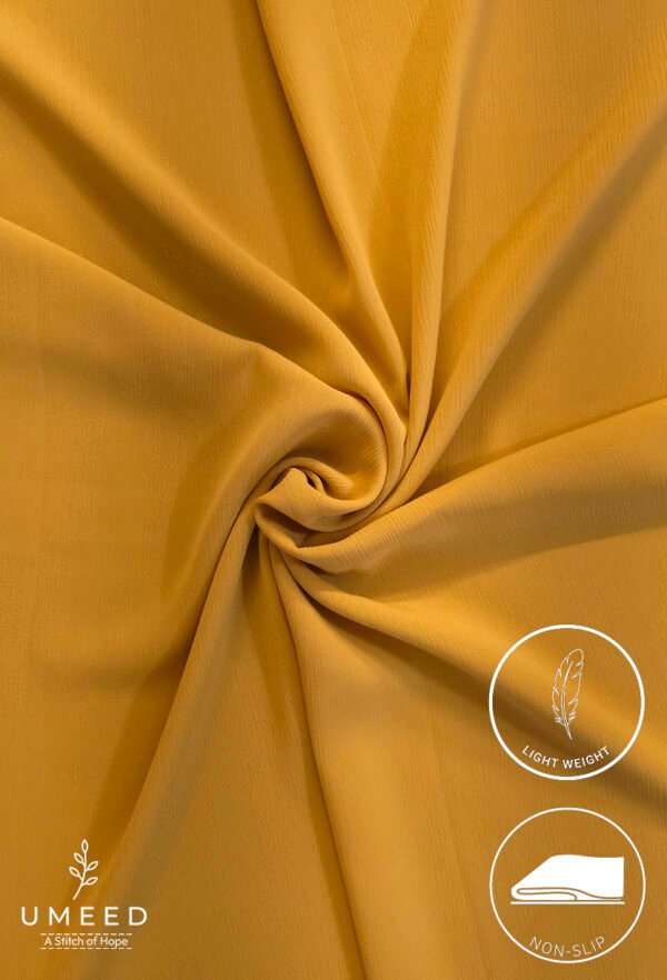 Lightweight, non-slip mustard yellow fabric for clothing or crafts.