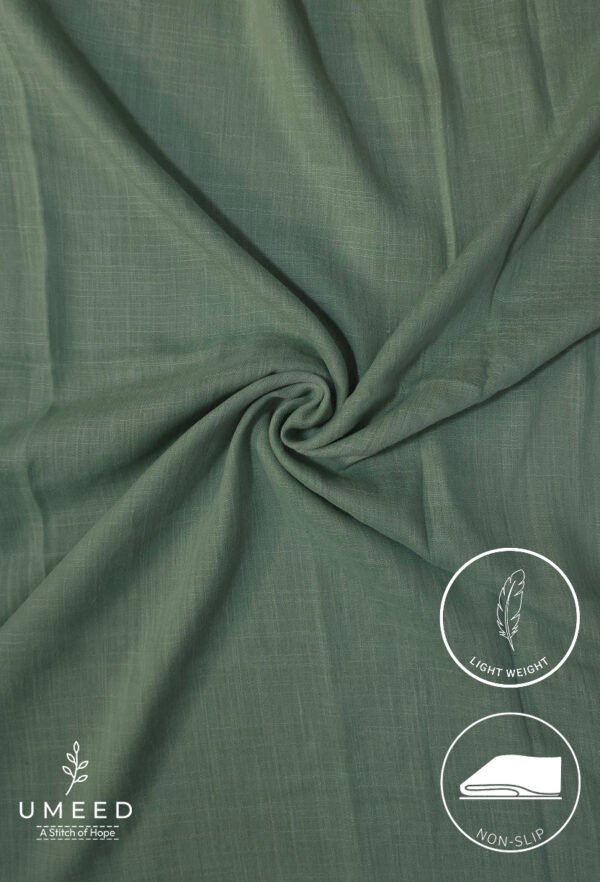 Lightweight green fabric with a smooth texture and subtle weave pattern.