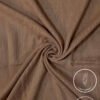 Lightweight, non-slip fabric in beige for clothing or crafts.