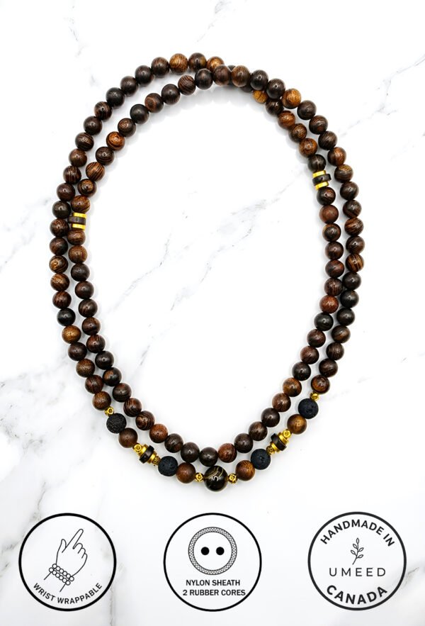 Handmade beaded necklace with wooden and gold accents from Umeed Designs.