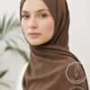 Elegant woman wearing a light weight, non-slip brown hijab from Umeed Designs.