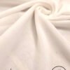 Elegant white fabric with subtle glitter for fashion or home decor.
