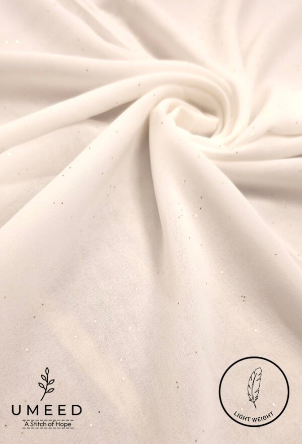 Elegant white fabric with subtle glitter for fashion or home decor.